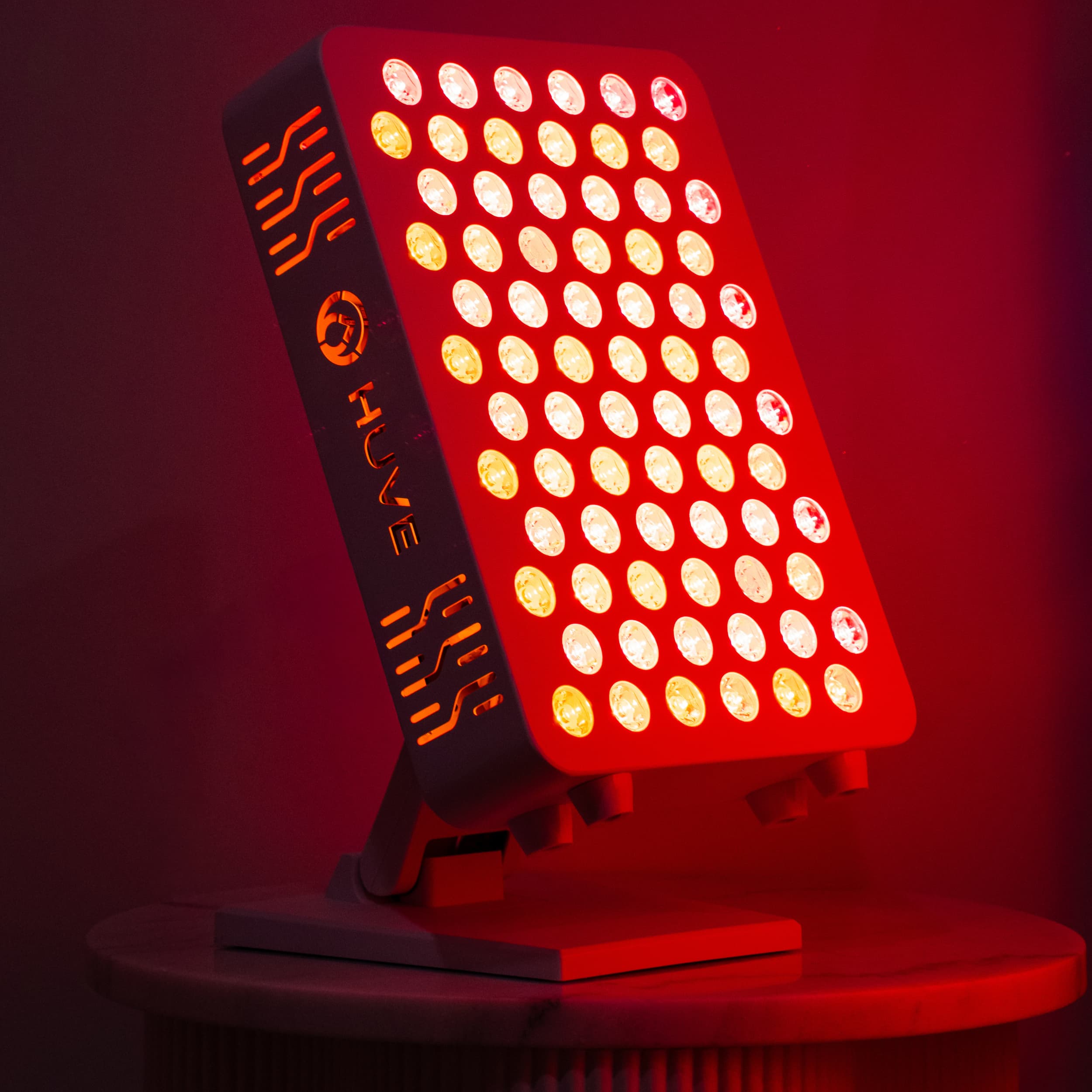 HUVE Luma red light therapy panel on tabletop stand