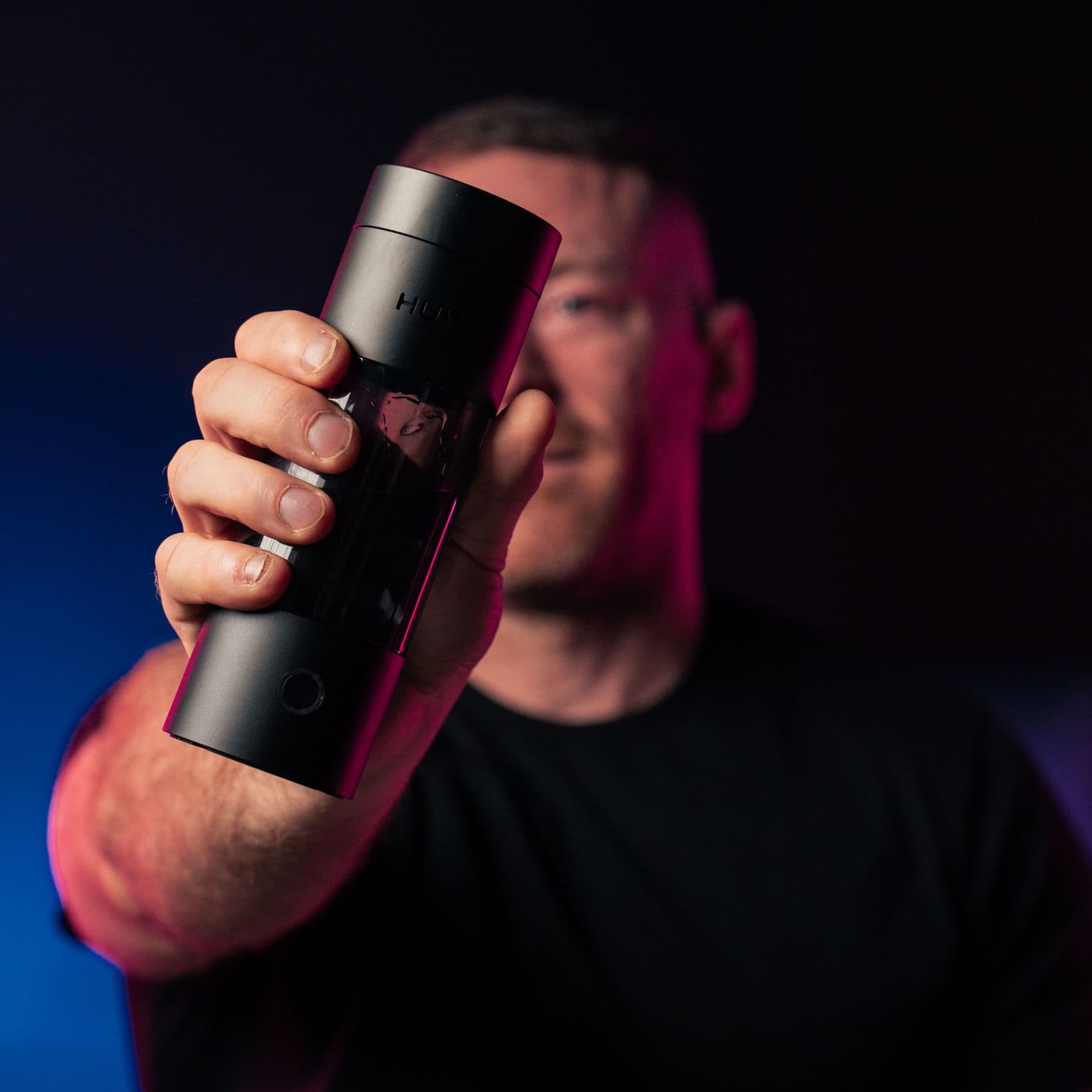 HUVE founder Josh Odgers holding a HUVE Perform hydrogen water bottle