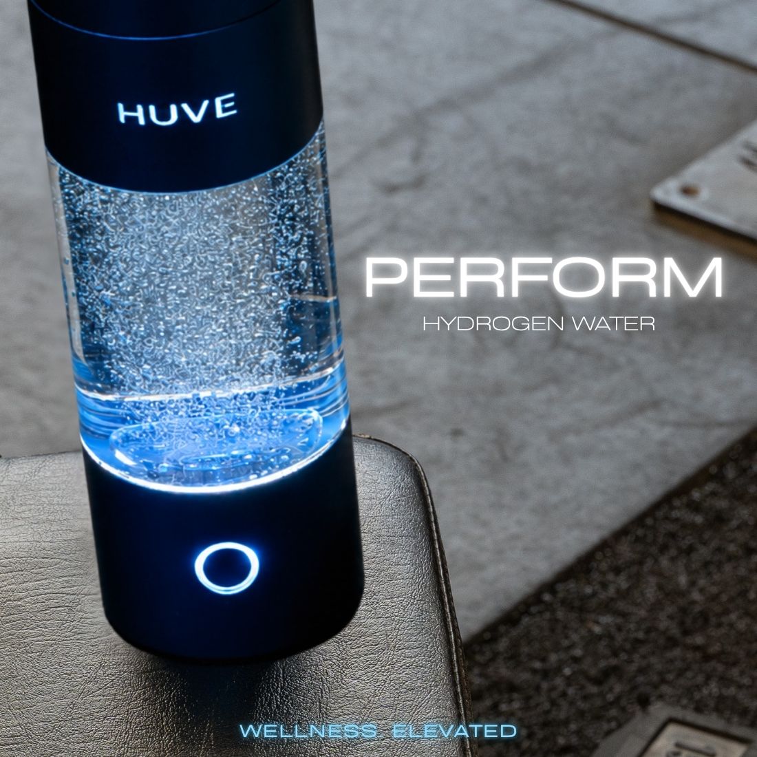 HUVE Perform hydrogen water bottle in black featured on gym bench