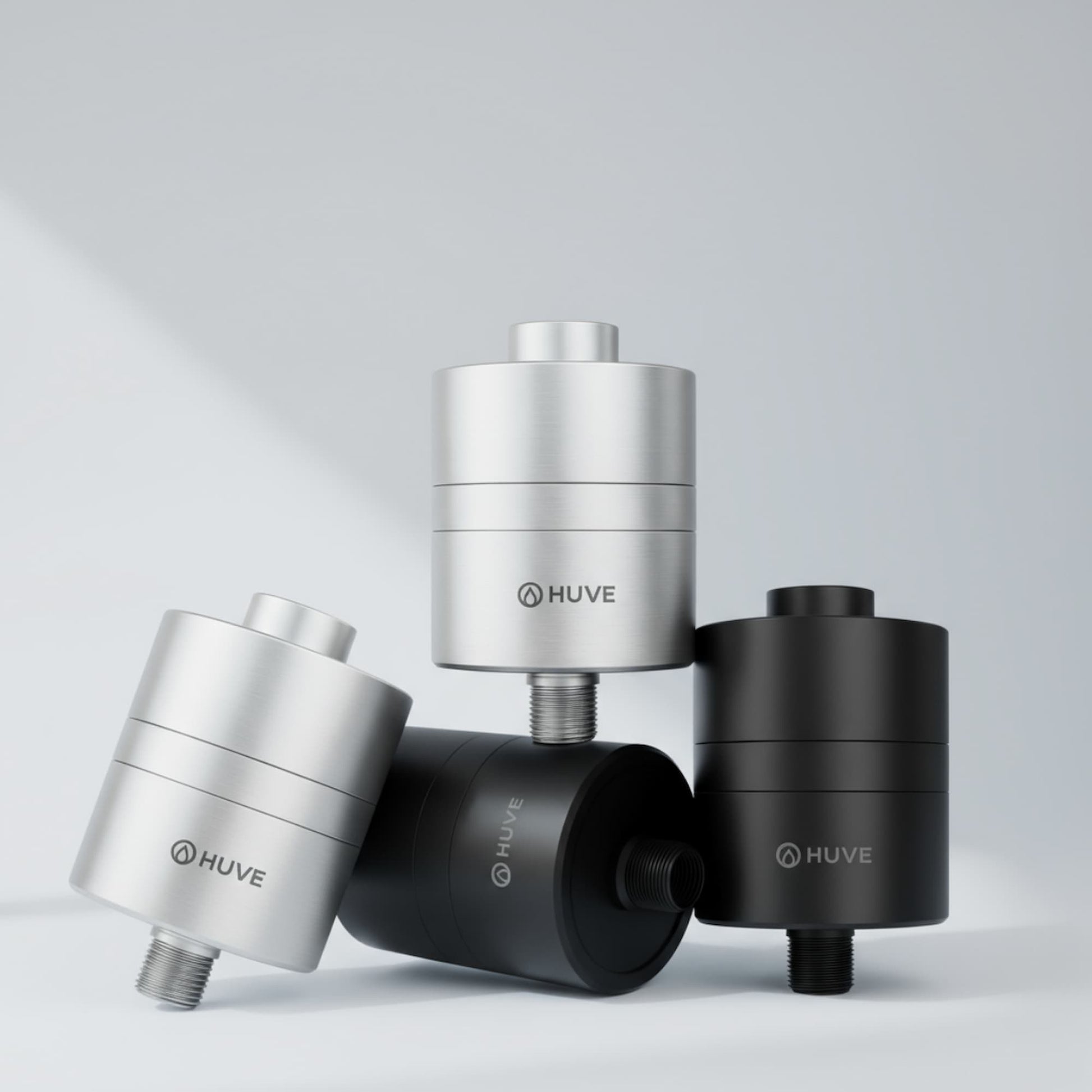 HUVE Flow premium shower filter shown in silver and black colour options