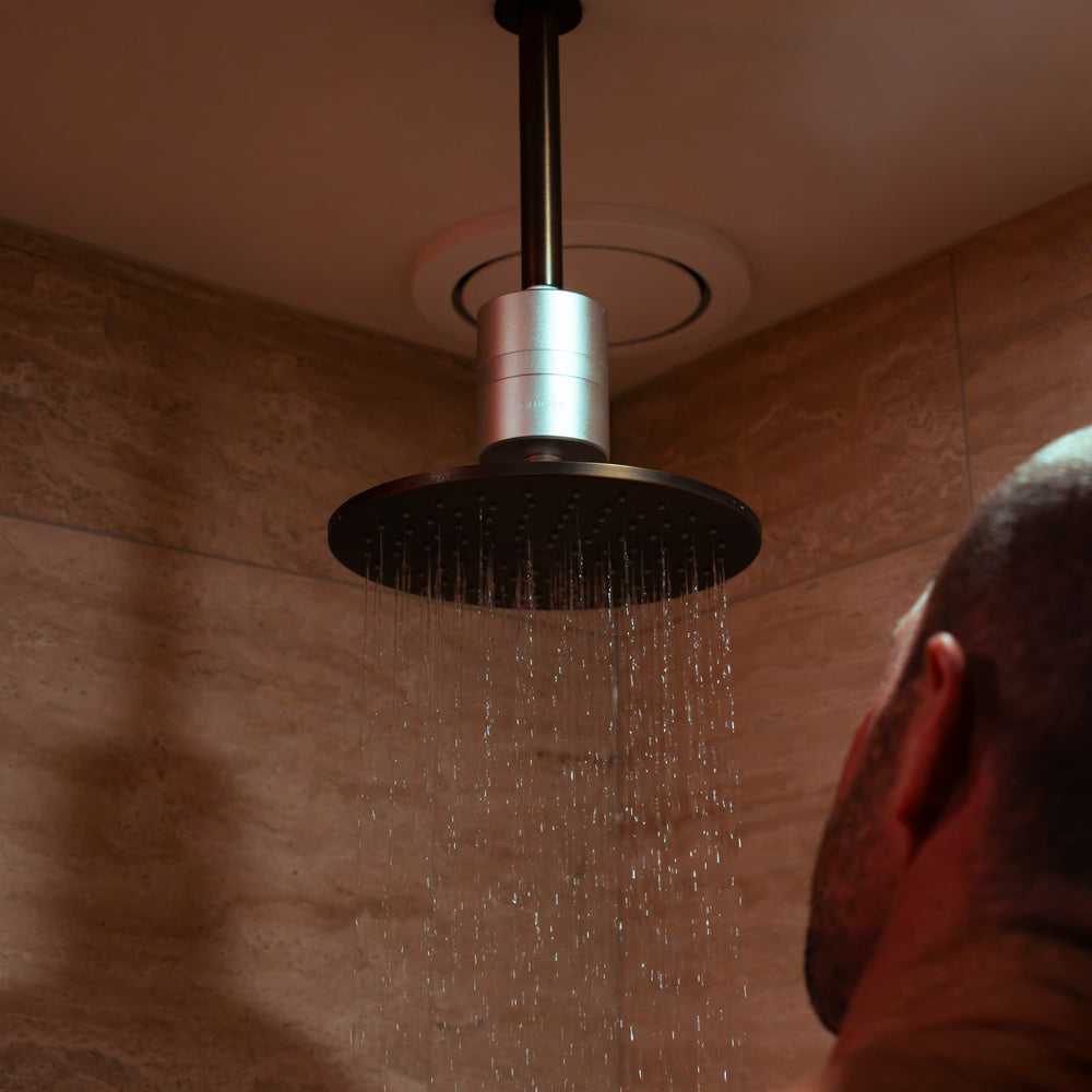 HUVE Flow shower filter installed on rain shower head, in use