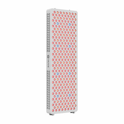 Angled left front view of HUVE Luma Restore Max full-body red light therapy panel in white with illuminated LED wavelengths