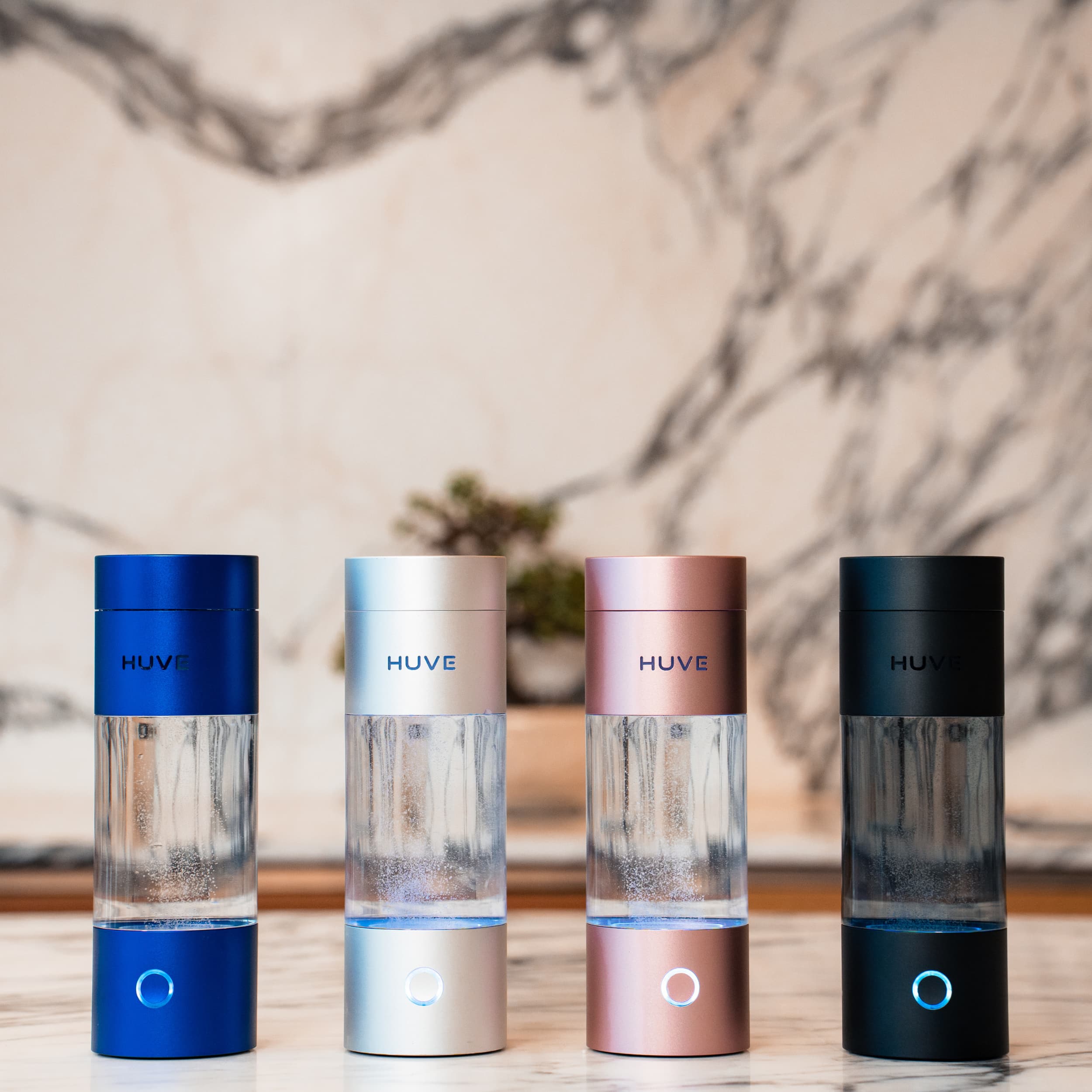 Four HUVE Perform hydrogen water bottles in different colors