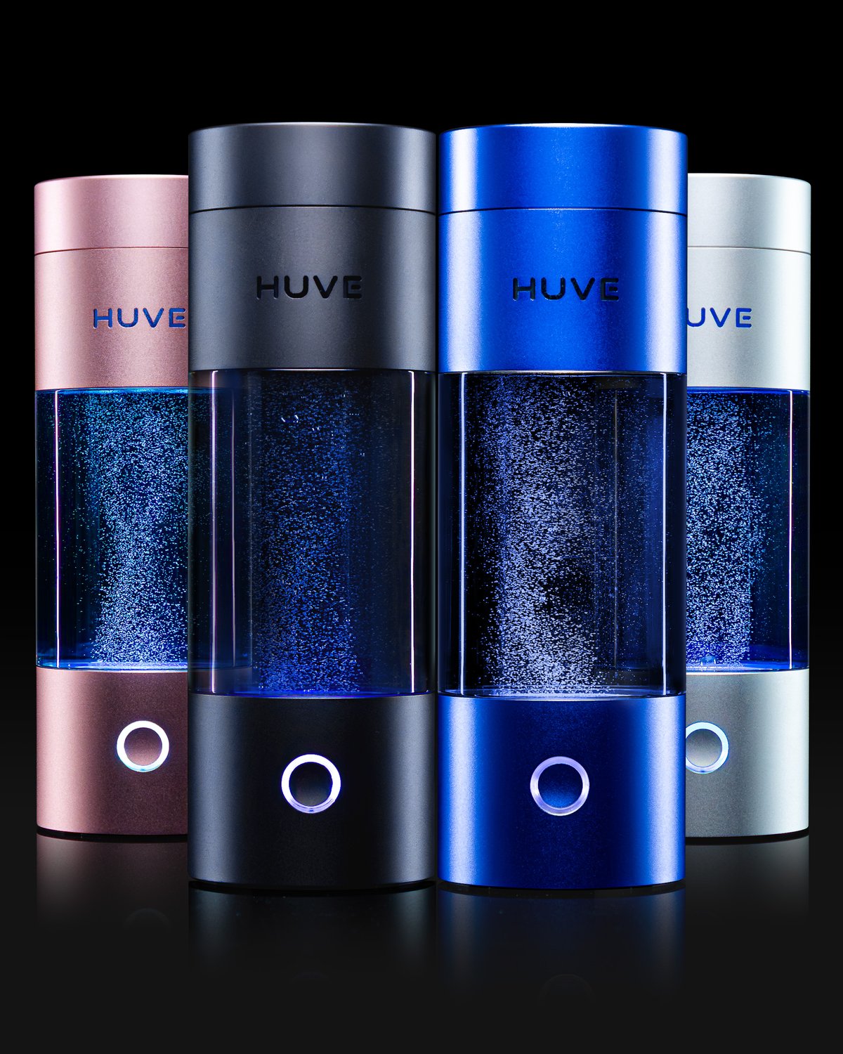 Four HUVE Perform hydrogen water bottles in studio, different colors