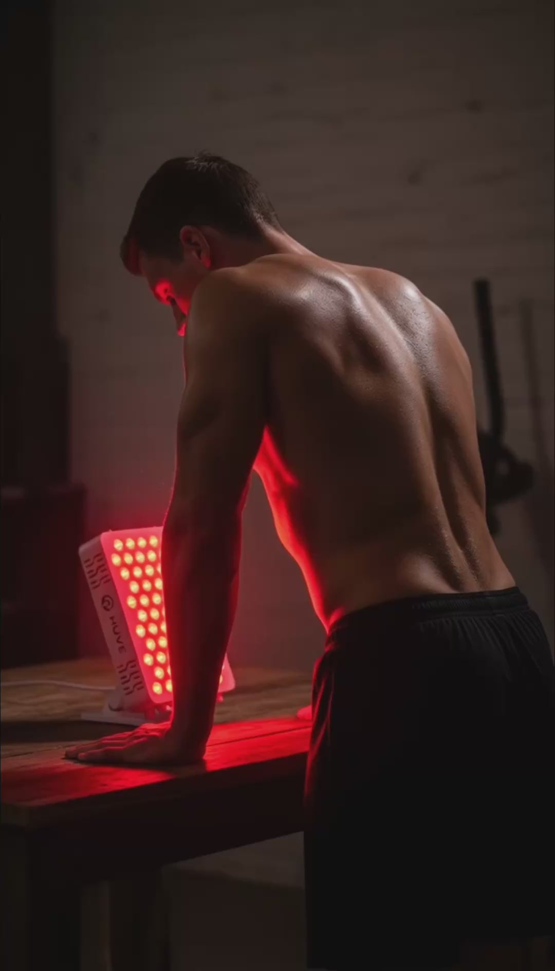 HUVE Luma Glow red light panel being used by a man post-training